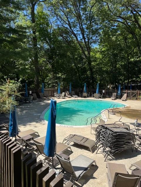 1 David Ln Unit 5E, Yonkers, NY 10701 - community pool featuring a patio area and view of scattered trees