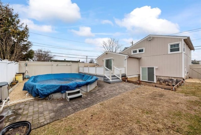 51 Graham St, Farmingdale, NY 11735 - back of house with a fenced in pool, a fenced backyard, a patio area, and a deck