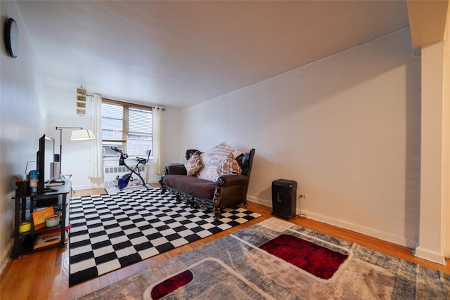 1480 Thieriot Ave Unit 2C, Bronx, NY 10460 - sitting room featuring wood finished floors, baseboards, and radiator heating unit