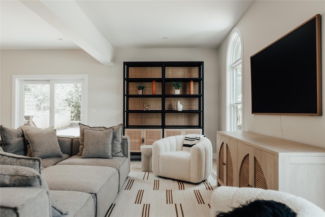 living area featuring beam ceiling