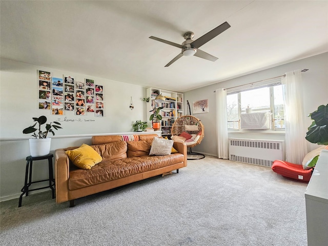 carpeted living room featuring radiator heating unit and a ceiling fan