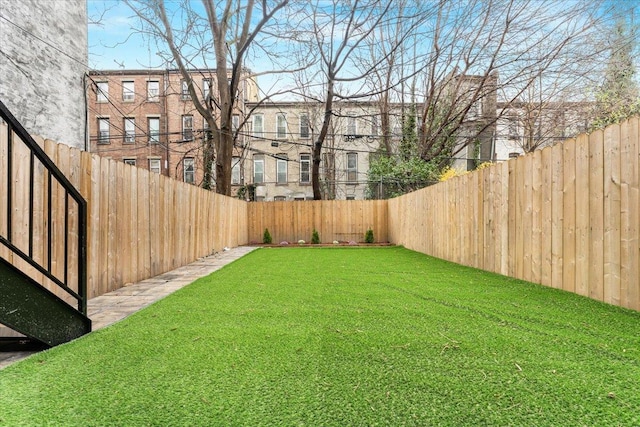 view of yard featuring a fenced backyard