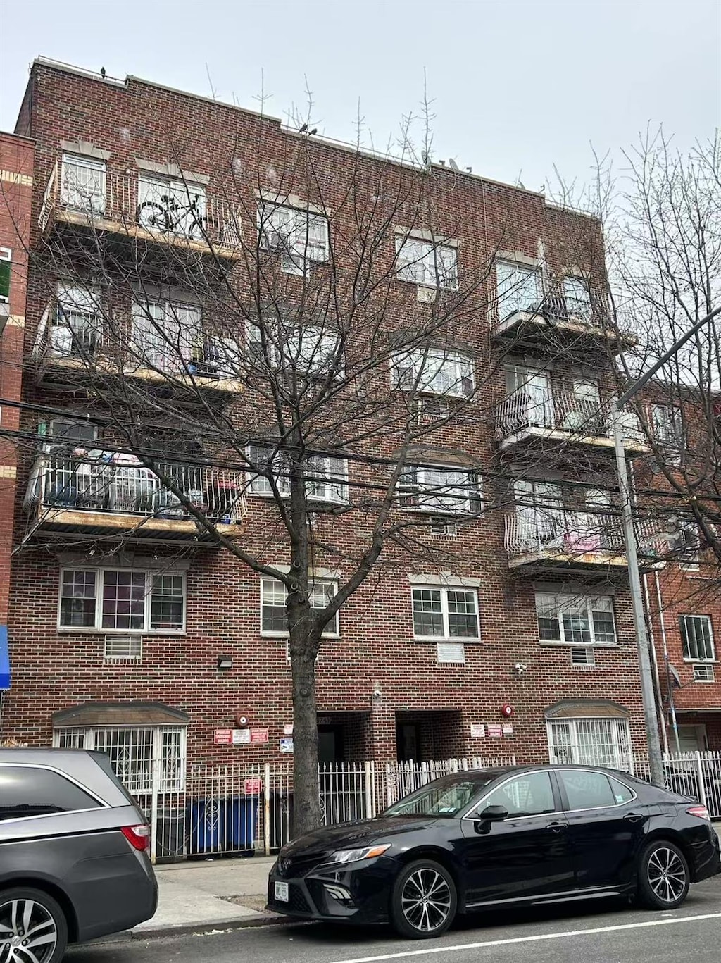 view of building exterior with fence