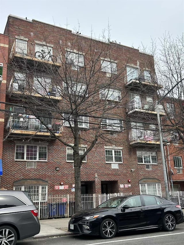 view of building exterior with fence