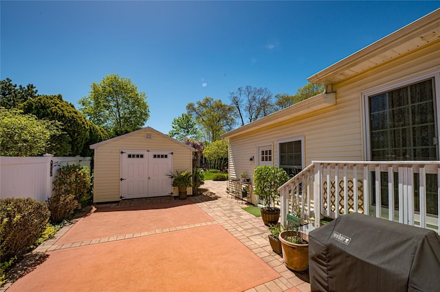 405 Linden St, Bellmore, NY 11710 - view of patio / terrace featuring an outdoor structure, fence, a shed, and area for grilling