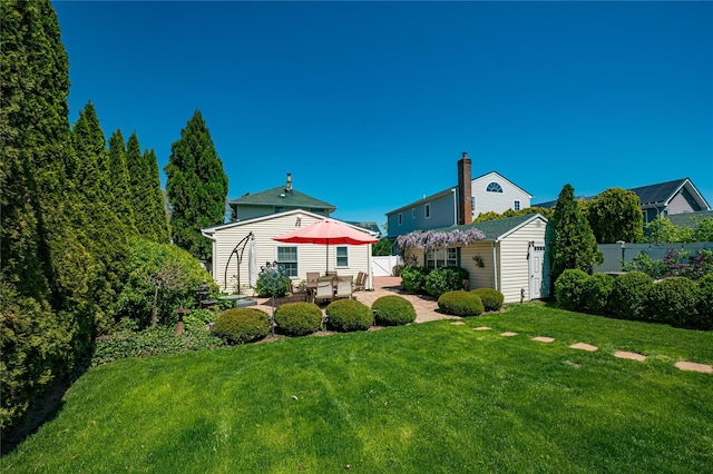 405 Linden St, Bellmore, NY 11710 - view of yard featuring fence, an outbuilding, and a patio area