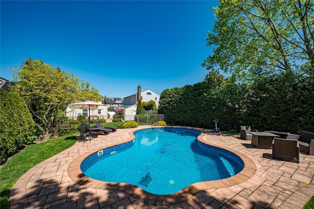 405 Linden St, Bellmore, NY 11710 - view of swimming pool with fence, a fire pit, a patio area, and a fenced in pool