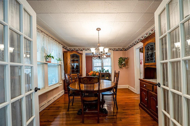 405 Linden St, Bellmore, NY 11710 - dining area featuring french doors, dark wood finished floors, baseboards, a baseboard radiator, and an inviting chandelier