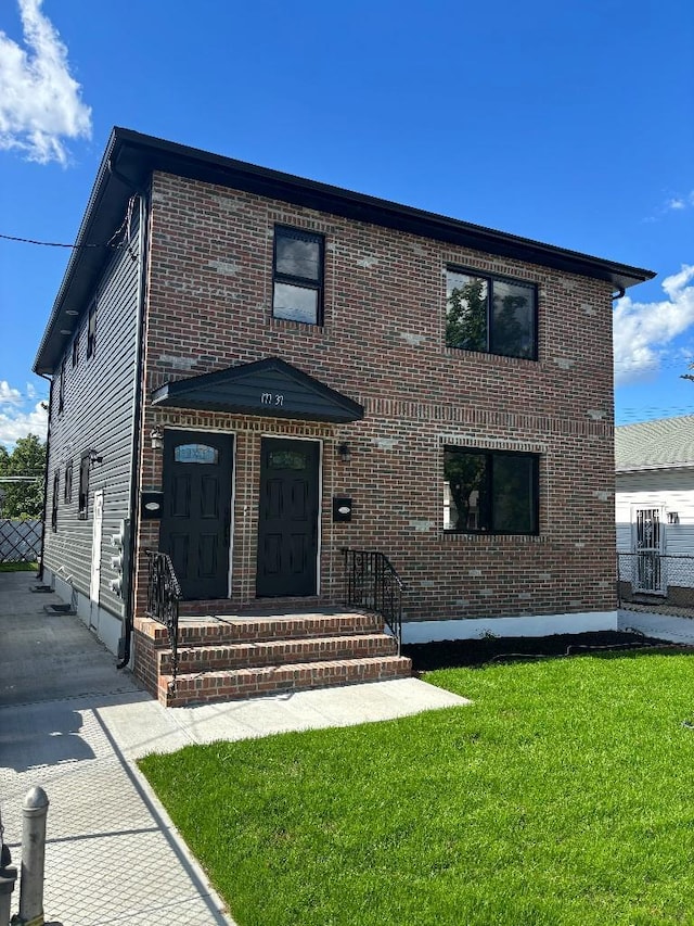 177-37 115th Ave, Saint Albans, NY 11434 - view of front of home with a front yard and brick siding