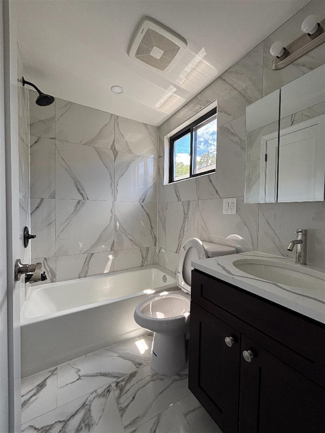 177-37 115th Ave, Saint Albans, NY 11434 - bathroom with vanity, bathing tub / shower combination, tile walls, toilet, and marble look tiles