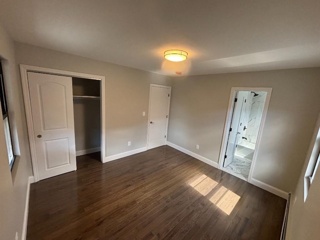 177-37 115th Ave, Saint Albans, NY 11434 - unfurnished bedroom featuring dark wood-style flooring, a closet, and baseboards