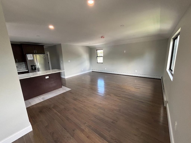 177-37 115th Ave, Saint Albans, NY 11434 - unfurnished living room with baseboards, dark wood-style floors, recessed lighting, a baseboard radiator, and baseboard heating