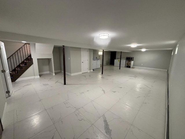 177-37 115th Ave, Saint Albans, NY 11434 - finished basement featuring stairs, light marble finish floors, and baseboards