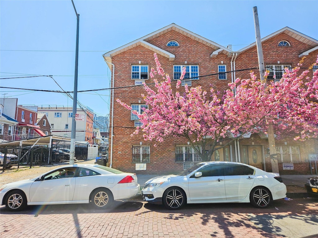 view of property featuring brick siding