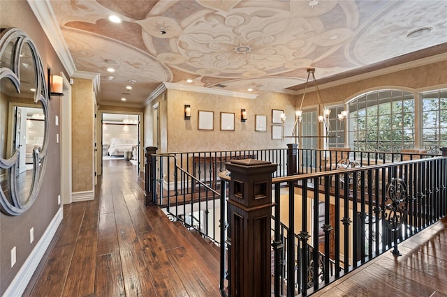 84 S Woods Rd, Woodbury, NY 11797 - hallway featuring crown molding, wood-type flooring, baseboards, and an upstairs landing