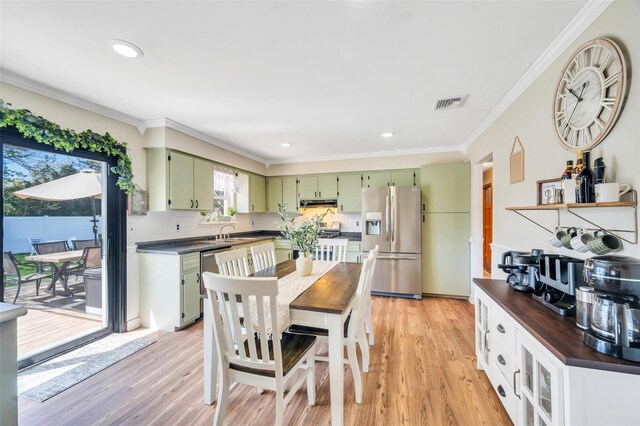 dining space featuring crown molding, recessed lighting, visible vents, and light wood-type flooring
