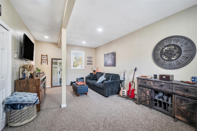 carpeted living room featuring recessed lighting and baseboards