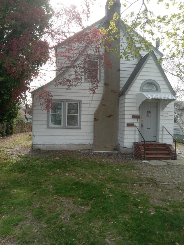 view of front of home with a chimney