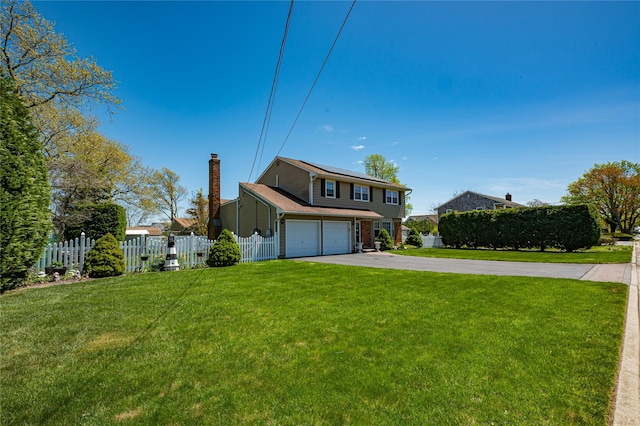 20 Bayview Rd, Amityville, NY 11701 - traditional-style home with driveway, fence, an attached garage, a front yard, and roof mounted solar panels
