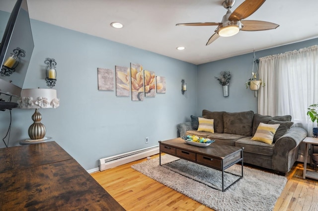 living room with a ceiling fan, wood finished floors, baseboards, a baseboard radiator, and recessed lighting