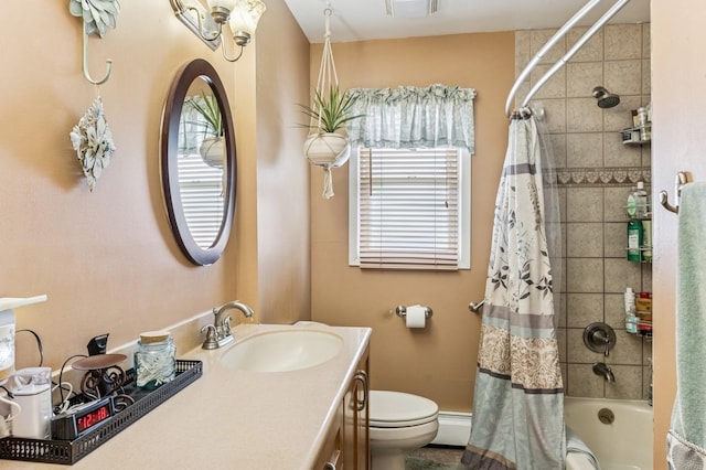 full bathroom with visible vents, vanity, toilet, baseboard heating, and shower / bath combo