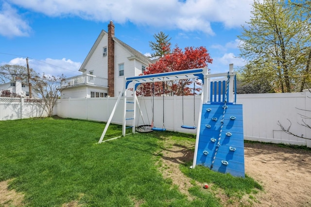 view of playground featuring a fenced backyard and a yard