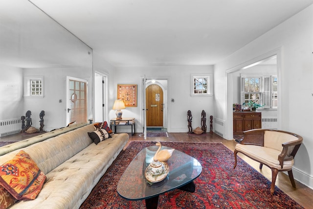 50 Oakland Ave, Tuckahoe, NY 10707 - living area featuring wood finished floors, baseboards, and radiator heating unit