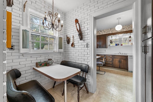 50 Oakland Ave, Tuckahoe, NY 10707 - dining area with light tile patterned floors and a chandelier
