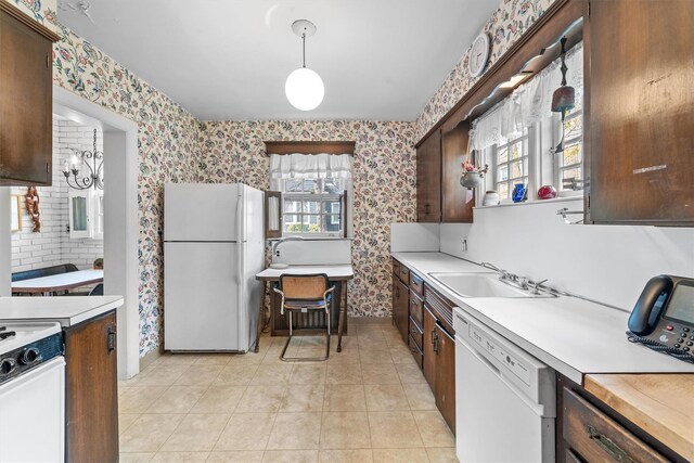 50 Oakland Ave, Tuckahoe, NY 10707 - kitchen featuring a sink, white appliances, light countertops, and wallpapered walls