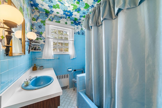 50 Oakland Ave, Tuckahoe, NY 10707 - full bathroom with tile walls, wallpapered walls, radiator heating unit, shower / bath combination with curtain, and vanity