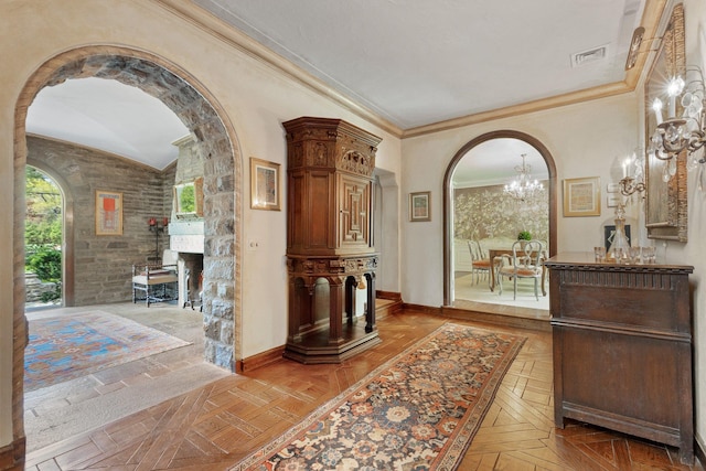 50 Hampshire Rd, Bronxville, NY 10708 - hallway with a chandelier, baseboards, arched walkways, crown molding, and lofted ceiling