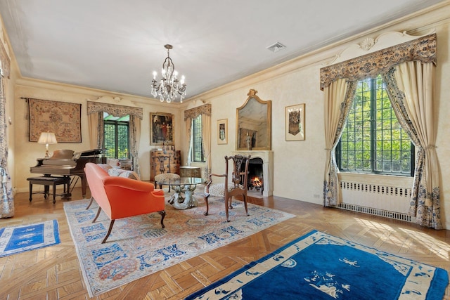 50 Hampshire Rd, Bronxville, NY 10708 - living room featuring a warm lit fireplace, radiator heating unit, visible vents, crown molding, and an inviting chandelier