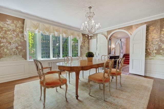 50 Hampshire Rd, Bronxville, NY 10708 - dining area featuring wallpapered walls, wainscoting, and arched walkways