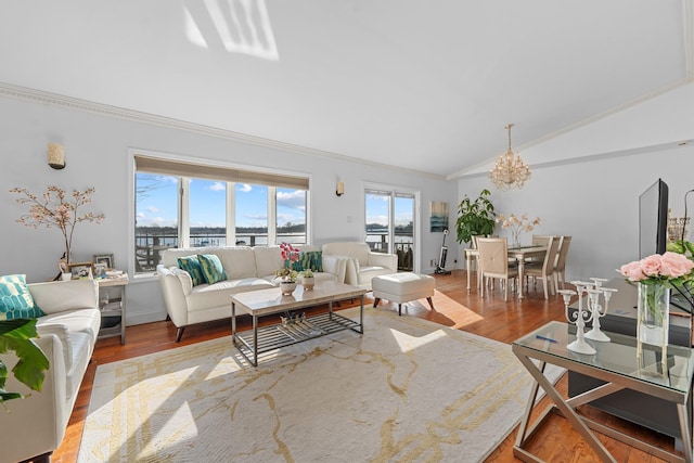299 Whitman Dr, Brooklyn, NY 11234 - living room featuring crown molding, a chandelier, wood finished floors, and lofted ceiling