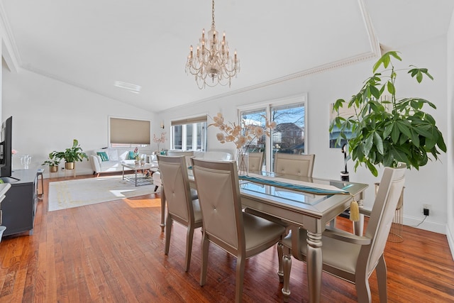 299 Whitman Dr, Brooklyn, NY 11234 - dining room with an inviting chandelier, crown molding, wood finished floors, and lofted ceiling