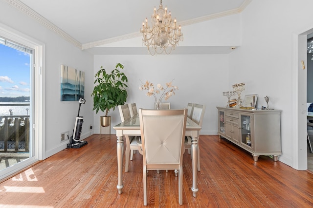 299 Whitman Dr, Brooklyn, NY 11234 - dining space featuring an inviting chandelier, ornamental molding, baseboards, and wood finished floors