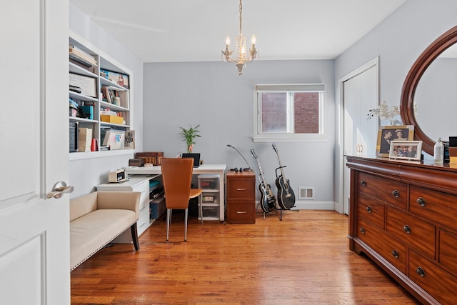 299 Whitman Dr, Brooklyn, NY 11234 - office area with an inviting chandelier, light wood-type flooring, and visible vents