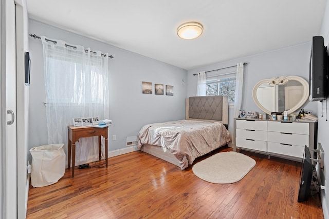 299 Whitman Dr, Brooklyn, NY 11234 - bedroom featuring wood finished floors and visible vents