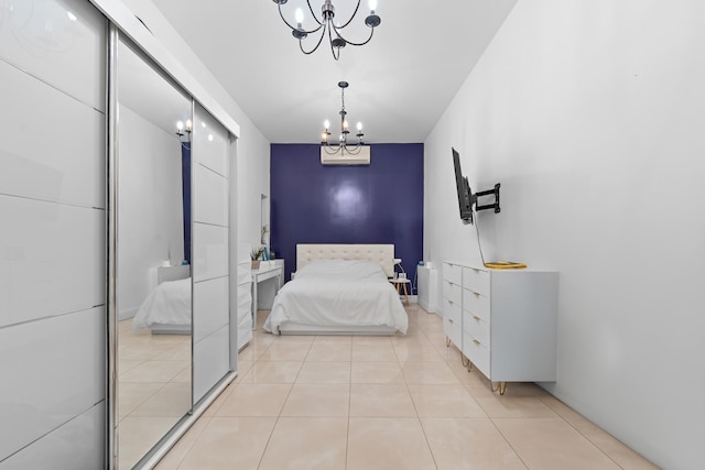 299 Whitman Dr, Brooklyn, NY 11234 - bedroom featuring light tile patterned floors and a chandelier
