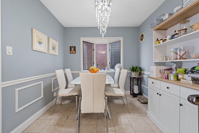 299 Whitman Dr, Brooklyn, NY 11234 - dining room with baseboards, light tile patterned flooring, and a chandelier