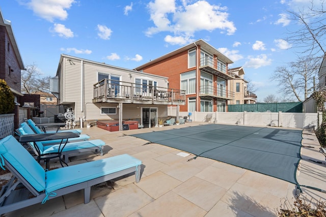 299 Whitman Dr, Brooklyn, NY 11234 - back of property featuring a hot tub, fence, a patio area, and a fenced in pool