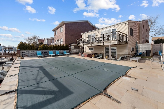 299 Whitman Dr, Brooklyn, NY 11234 - view of pool featuring a fenced in pool, fence, a wooden deck, and a patio area