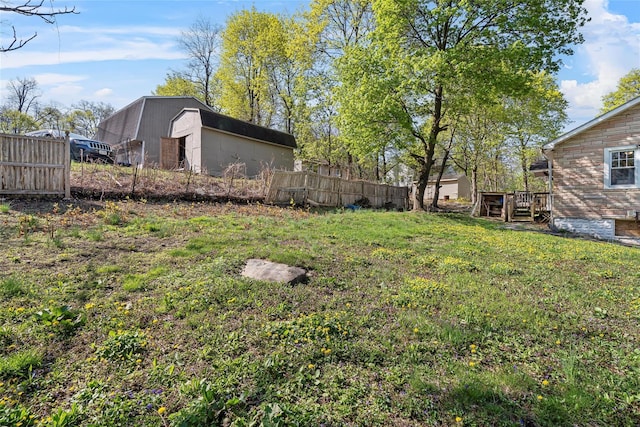 57 Higgins Trl, Monroe, NY 10950 - view of yard featuring fence, an outbuilding, and a storage unit
