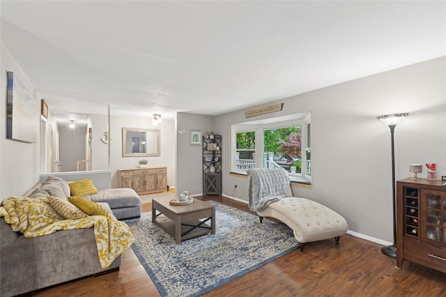 living area featuring wood finished floors and baseboards