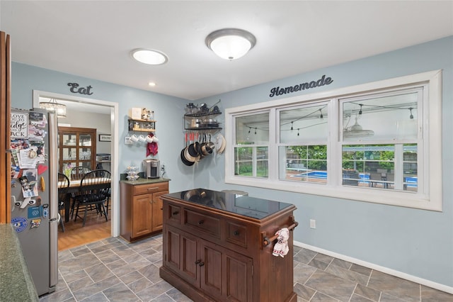 office space with stone finish floors and baseboards