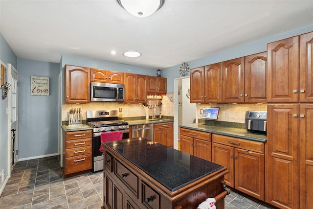 kitchen featuring stainless steel appliances, decorative backsplash, brown cabinetry, and recessed lighting