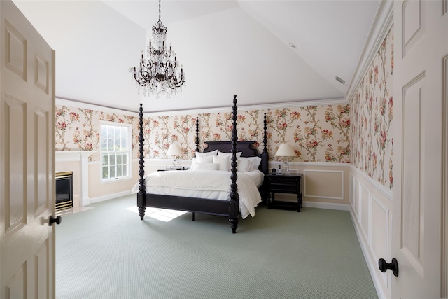 carpeted bedroom with an inviting chandelier, visible vents, lofted ceiling, wallpapered walls, and a wainscoted wall