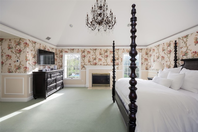 bedroom with a fireplace with flush hearth, light carpet, vaulted ceiling, and wallpapered walls