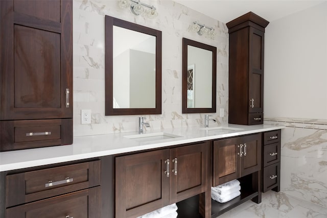 bathroom with vanity, tile walls, and marble finish floor