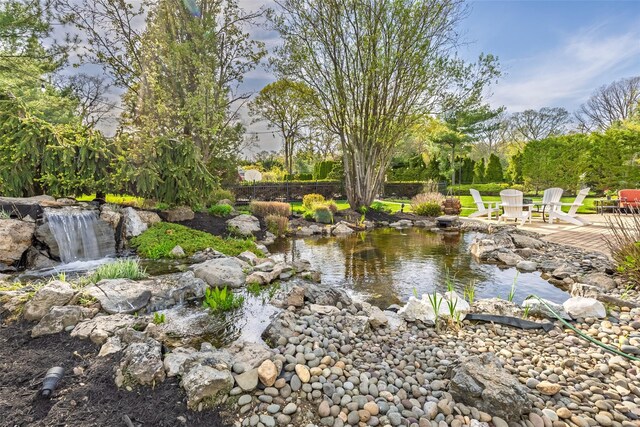 water view featuring a small pond